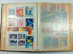 A collection of stamps in an album from 1960 to 1990