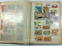 A collection of stamps in an album from 1960 to 1990