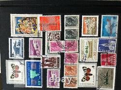 International stamp collection lot in Album 8.5 long x 6wide many stamps