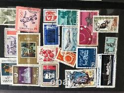 International stamp collection lot in Album 8.5 long x 6wide many stamps
