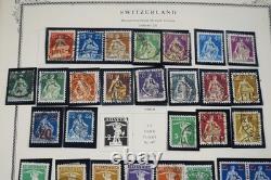 SWITZERLAND 1860s-1970s COLLECTION OF 1,000+ STAMPS STORED IN SCOTT ALBUM