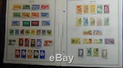 Surinam stamp collection on Minkus album pages to'92 with 910 stamps or so