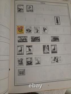 The New Statesman Deluxe H. E. Harris Stamp Album With Stamps