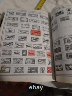 The New Statesman Deluxe H. E. Harris Stamp Album With Stamps