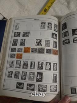 The New Statesman Deluxe H. E. Harris Stamp Album With Stamps
