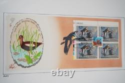 US 1980s-1990s COLLECTION OF 50+ PUGH HAND PAINTED FDCS STORED IN ALBUM