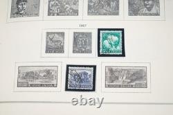 WORLDWIDE 1900s-1970s I/K COLLECTION OF 900+ STAMPS MINT & USED IN SCOTT ALBUM
