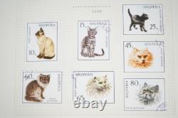WORLDWIDE 1920s-70s COLLECTION OF 850+ STAMPS MINT & USED STORED IN AN ALBUM A-K