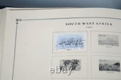 WORLDWIDE 1980s-1990s COLLECTION OF 1,550+ STAMPS MINT & USED IN SCOTT ALBUM