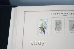 WORLDWIDE 1980s-1990s COLLECTION OF 1,550+ STAMPS MINT & USED IN SCOTT ALBUM