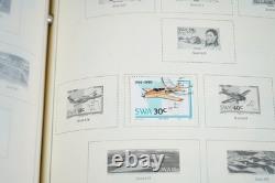 WORLDWIDE 1980s-1990s COLLECTION OF 1,550+ STAMPS MINT & USED IN SCOTT ALBUM