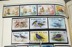 WORLDWIDE A/V 1970s COLLECTION OF 600+ MOSTLY MINT STAMPS STORED IN SCOTT ALBUM