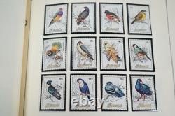 WORLDWIDE A/Z 1980s COLLECTION OF 625+ MOSTLY MINT STAMPS STORED IN SCOTT ALBUM
