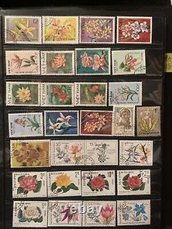 Worldwide stamps collections lots in album used flowers & animals stamps