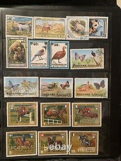 Worldwide stamps collections lots in album used flowers & animals stamps