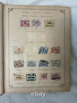 1 552 timbres usagés dans un album de timbres postes anciens de plus de 62 pays avec charnières