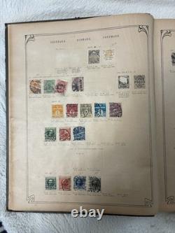 1 552 timbres usagés dans un album de timbres postes anciens de plus de 62 pays avec charnières