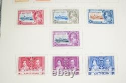 AFRIQUE BRITANNIQUE 1860s-1960s COLLECTION DE PLUS DE 2000 TIMBRES NEUFS ET USAGÉS ALBUM SCOTT