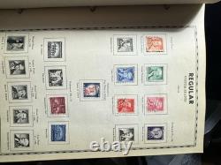 Album de timbres illustré vintage autour du monde avec quelques timbres à l'intérieur (tel quel)