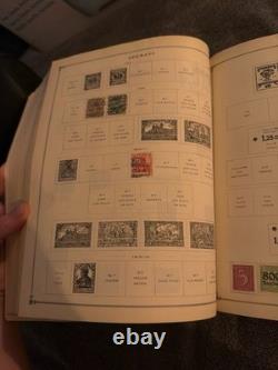 Ancien album de timbres-poste International Junior de 1939 rempli de timbres de collection