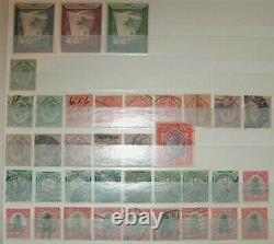 Belle collection de timbres étrangers dans un classeur d'actions neufs et usagés, des centaines de timbres.