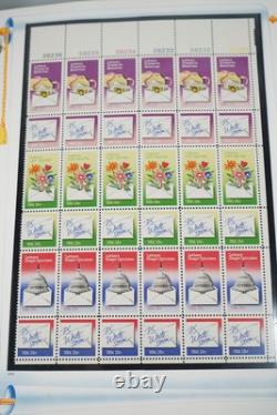 COLLECTION AMÉRICAINE DES ANNÉES 1980 DE PLUS DE 180 BLOCS DE PLAQUE NEUFS VALANT $260 RANGÉS DANS UN ALBUM