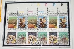 COLLECTION AMÉRICAINE DES ANNÉES 1980 DE PLUS DE 180 BLOCS DE PLAQUE NEUFS VALANT $260 RANGÉS DANS UN ALBUM
