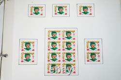 COLLECTION DE TIMBRES DE NOËL AMÉRICAINS DES ANNÉES 1950-1990 DE PLUS DE 80 FEUILLES ET DANS 2 ALBUMS
