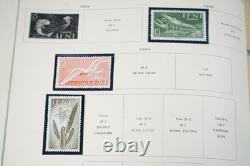 COLLECTION MONDIALE 1900-1970 I/K DE PLUS DE 900 TIMBRES NEUFS ET USAGÉS DANS UN ALBUM SCOTT
