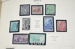 COLLECTION MONDIALE 1900-1970 I/K DE PLUS DE 900 TIMBRES NEUFS ET USAGÉS DANS UN ALBUM SCOTT