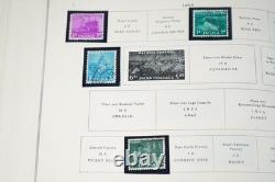 COLLECTION MONDIALE 1900-1970 I/K DE PLUS DE 900 TIMBRES NEUFS ET USAGÉS DANS UN ALBUM SCOTT