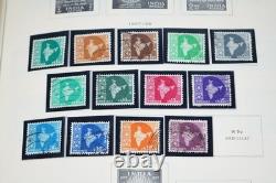 COLLECTION MONDIALE 1900-1970 I/K DE PLUS DE 900 TIMBRES NEUFS ET USAGÉS DANS UN ALBUM SCOTT