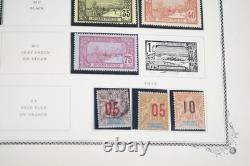 COLLECTION MONDIALE DE PLUS DE 5 600 TIMBRES DES ANNÉES 1890 AUX ANNÉES 1990, NEUFS ET OBLITÉRÉS, DANS UN ALBUM HARRIS