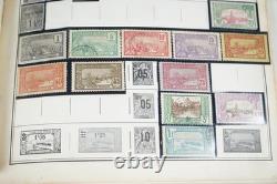 COLLECTION MONDIALE DE PLUS DE 5 600 TIMBRES DES ANNÉES 1890 AUX ANNÉES 1990, NEUFS ET OBLITÉRÉS, DANS UN ALBUM HARRIS