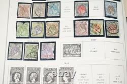 COLLECTION MONDIALE DE TIMBRES 1860-1960 DE 650 TIMBRES NEUFS ET USAGÉS DANS UN ALBUM SCOTT
