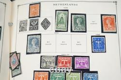 COLLECTION MONDIALE DE TIMBRES 1860-1960 DE 650 TIMBRES NEUFS ET USAGÉS DANS UN ALBUM SCOTT