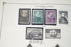 COLLECTION MONDIALE DE TIMBRES 1860-1960 DE 650 TIMBRES NEUFS ET USAGÉS DANS UN ALBUM SCOTT