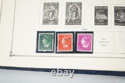 COLLECTION MONDIALE DE TIMBRES 1860-1960 DE 650 TIMBRES NEUFS ET USAGÉS DANS UN ALBUM SCOTT