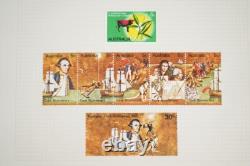 COLLECTION MONDIALE DE TIMBRES DES ANNÉES 1920 À 1970, PLUS DE 850 TIMBRES NEUFS ET USAGÉS STOCKÉS DANS UN ALBUM A-K