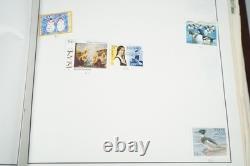 COLLECTION MONDIALE DES ANNÉES 1920 AUX ANNÉES 1980 DE PLUS DE 3 500 TIMBRES NEUFS ET OBLITÉRÉS DANS UN ALBUM HARRIS