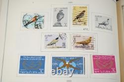 COLLECTION MONDIALE K-M 1910-1970 DE PLUS DE 2 750 TIMBRES NEUFS ET USAGÉS DANS UN ALBUM