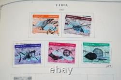 COLLECTION MONDIALE K-M 1910-1970 DE PLUS DE 2 750 TIMBRES NEUFS ET USAGÉS DANS UN ALBUM