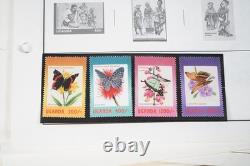 COLLECTION MONDIALE U-T ANNÉES 1910-1970 DE PLUS DE 800 TIMBRES NEUFS ET USAGÉS SUR PAGES D'ALBUM