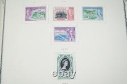 COLONIES BRITANNIQUES 1860s-1960s COLLECTION DE PLUS DE 1 150 TIMBRES NEUFS ET USAGÉS DANS UN ALBUM