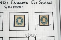 Collection américaine de timbres découpés et d'emballages de papeterie postale dans un album