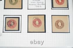 Collection américaine de timbres découpés et d'emballages de papeterie postale dans un album