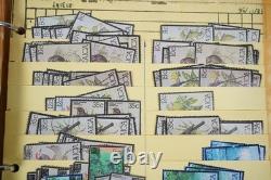 Collection britannique du Commonwealth de plus de 1 700 timbres utilisés, rangée dans un album