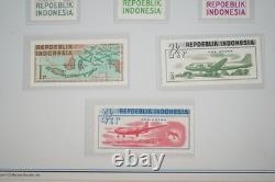 Collection d'Indonésie de 140 timbres et 4 feuillets dans un album spécialisé et pages d'album
