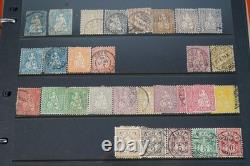 Collection de 2 300+ timbres de Suisse neufs et utilisés sur pages de stock dans un album