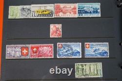 Collection de 2 300+ timbres de Suisse neufs et utilisés sur pages de stock dans un album